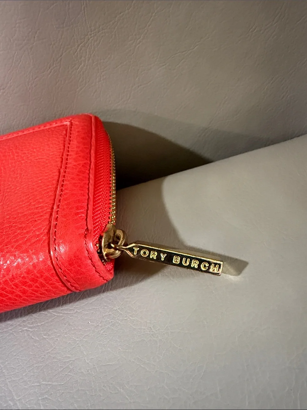 Tory Burch orange Pebbled Leather Zip Wallet with Gold Logo